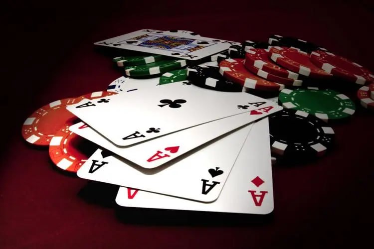 Quickspin game interface showing reels, stake selector, and spin button